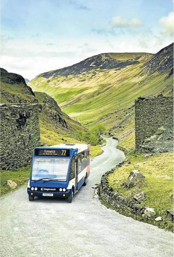  ?? CORBIS ?? GOING UP: A rural community bus service to Keswick climbs Honister Pass in England’s green and pleasant Lake District