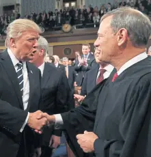  ?? GETTY IMAGES FILE ?? BOILING POINT: President Trump shakes hands with Supreme Court Chief Justice John Roberts on Feb. 28, 2017.