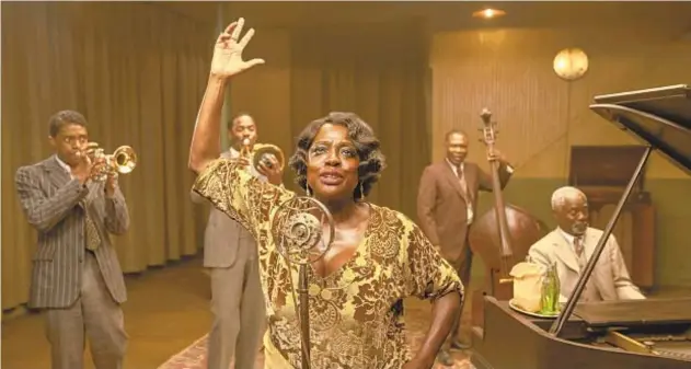  ?? DAVID LEE/NETFLIX ?? Chadwick Boseman, from left, Colman Domingo, Viola Davis, Michael Potts and Glynn Turman perform in “Ma Rainey’s Black Bottom.” Netflix has unveiled the film in a limited theatrical run and will begin streaming it Dec. 18.