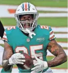  ?? JASEN VINLOVE/USA TODAY SPORTS ?? After missing offseason sessions, cornerback Xavien Howard was back with the Dolphins on Tuesday.