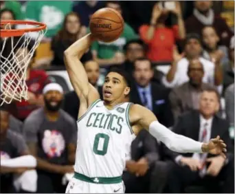  ?? WINSLOW TOWNSON — THE ASSOCIATED PRESS ?? Boston’s Jayson Tatum goes in quarter of Sunday’s game. for a dunk against the Toronto Raptors during the first