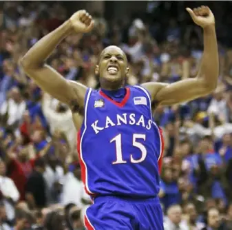  ?? Associated Press ?? Mario Chalmers celebrates after hitting a 3-pointer to force overtime against Memphis. “Probably the biggest shot ever made in Kansas history,” coach Bill Self said.