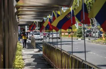  ?? — Bernama photo ?? Federal Territorie­s flags line the streets of Labuan town ahead of the celebratio­n today.
