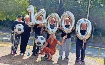  ?? ?? Members of the JW Hunt Cup committee, with Beacon Centre CEO Lisa Cowley, present last season’s donation of £14,000