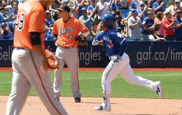  ?? DAN HAMILTON/USA TODAY SPORTS ?? Devon Travis rounds the bases after his solo homer off Yovani Gallardo in the fifth inning opened the floodgates for the Blue Jays against Manny Machado and the Orioles.