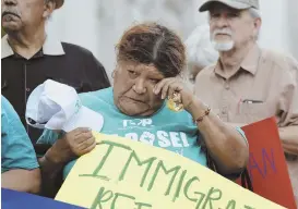  ?? AP PHOTO ?? TEARS AFTER TRAGEDY: Mourners at a vigil outside the San Fernando Cathedral in San Antonio Sunday marked the deaths of at least 10 immigrants in an overheated tractor trailer.