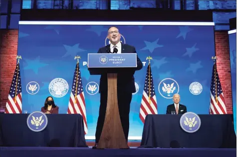  ?? Carolyn Kaster / Associated Press ?? Miguel Cardona, President-elect Joe Biden’s nominee for Secretary of Education, speaks after being introduced at The Queen Theater in Wilmington, Del., on Wednesday, as Biden, right, and Vice President-elect Kamala Harris, look on.