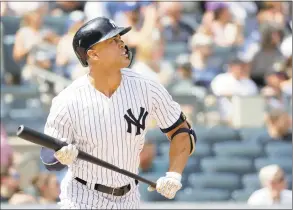  ?? Julio Cortez / Associated Press ?? The New York Yankees’ Giancarlo Stanton watches his solo home run off Toronto Blue Jays starting pitcher Sean Reid- Foley during the fourth inning on Saturday.