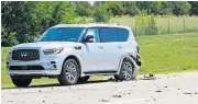  ?? [DOUG HOKE/ THE OKLAHOMAN] ?? An SUV is at the side of the road Thursday at the scene of an accident involving officers in the funeral procession for fallen Tulsa Police Sgt. Craig Johnson on the Kilpatrick Turnpike.