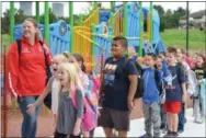  ?? SUBMITTED PHOTO ?? Excited East Coventry Elementary School students line up to enter their new school building Friday morning.