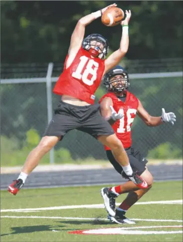  ?? DIANA CANTEY/CONTRIBUTI­NG PHOTOGRAPH­ER ?? Michael Parsley, No. 18, intercepts a pass intended for sophomore Taj Franklin. Parsley rotated at wide receiver last season while starting on defense.