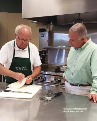  ??  ?? John Hanson makes lutefisk. John McGivern watches.