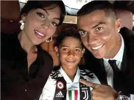  ??  ?? La Dolce Vita: a family affair as girlfriend Georgina and son Cristiano Jnr join the fun