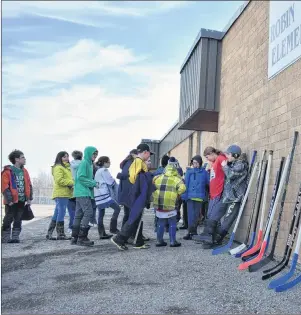  ?? GREG MCNEIL/CAPE BRETON POST ?? Hockey sticks sit outside of Robin Foote Elementary in Westmount on Thursday as a show of support for the Humboldt Broncos junior hockey team that was involved in a tragic bus crash.