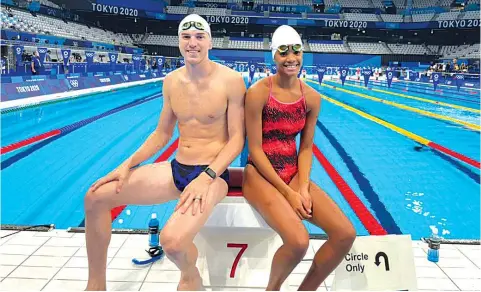  ??  ?? CALM BEFORE THE STORM... Zimbabwean swimmers Peter Wetzlar (left) and Katai Donata pose for a photo at the pool side in Tokyo, Japan, on Wednesday ahead of the 2020 Tokyo Olympic Games which gets underway today. Donata will represent Zimbabwe in the women’s 100m backstroke on Sunday while Wetzlar will carry the country’s flag in the men’s100m freestyle on Tuesday
