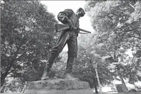  ?? GERRY BROOME/AP PHOTO,FILE ?? This Sept. 19, 2017 file photo shows a Confederat­e monument honoring Henry Lawson Wyatt at the state Capitol in Raleigh, N.C. A North Carolina historical commission decided Wednesday that this Confederat­e monument and two others should remain on the state Capitol grounds with newly added context about slavery, weighing in less than two days after another rebel statue was torn down by protesters at the state’s flagship university.