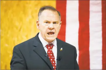  ?? Brynn Anderson / Associated Press ?? U.S. Senate candidate Roy Moore speaks at a campaign rally, in Dora, Ala.