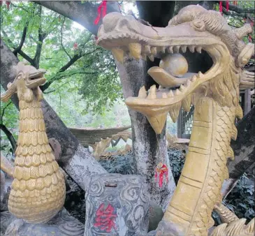  ?? PHOTOS: PAT EATON-ROBB ASSOCIATED PRESS ?? An ornamented wishing tree at Elephant Trunk Park is a popular spot for young couples strolling along the Li River to attach padlocks or wish ribbons, signifying lasting love. Fried insects are among the offerings of nearby vendors.