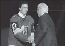  ?? ETHAN MILLER, GETTY IMAGES ?? Goaltender Marc-Andre Fleury shakes hands with majority owner Bill Foley of the Vegas Golden Knights after Fleury was taken in the expansion draft Wednesday.