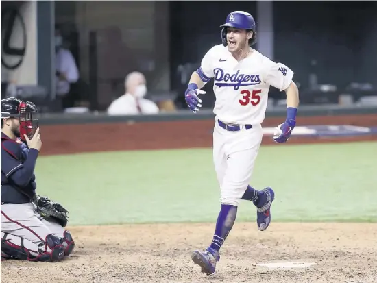  ?? PHOTOS COURTOISIE ?? Cody Bellinger marque le point gagnant après avoir frappé un coup de circuit en solo à la septième manche, hier.