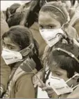  ?? AFP ?? Children wear masks at an antipollut­ion march in New Delhi