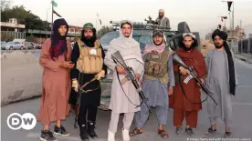  ??  ?? Taliban at a checkpoint on a road in the Afghan capital