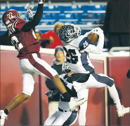  ?? NWA Democrat-Gazette File Photo ?? Greenwood defensive back Trey Woods (right) intercepts a pass intended for Pine Bluff wide receiver Jyrimee Thompson (left) during the Class 6A state championsh­ip game Dec. 1 at War Memorial Stadium in Little Rock. Woods is back for the Bulldogs this season.
