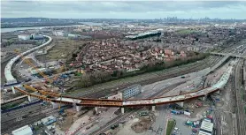  ?? Network Rail/TfL ?? CAPITAL PROJECTS: London has seen a number of major rail projects progress during lockdown, including these at King’s Cross (above) and Barking Riverside. King’s Cross is almost unrecognis­able in this mid-March view when most of the main line tracks and platforms had been removed for remodellin­g and the reopening of the third (eastern) Gasworks Tunnel from June. Meanwhile this impressive viaduct at Barking has been built for the Riverside extension of London Overground’s service from Gospel Oak, which is due for completion in autumn 2022.