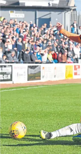  ?? Pictures:SNS. ?? Above: Paul McMullen is beaten to the ball on this occasion by Ayr’s Daniel Harvie. Right: Dundee United’s Benjamin Siegrist gets down to save at the feet of Lawrence Shankland.