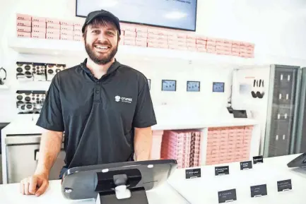  ?? ARIEL COBBERT/COMMERCIAL APPEAL FILE ?? Crumbl Cookies store owner Sam Hiatt, pictured at his first Memphis location on South Mendenhall Road on July 6, 2021, is opening another location in the Shops of Saddle Creek.