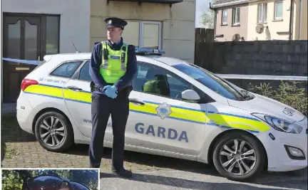  ??  ?? A garda on duty at the scene in the Ashbrook estate and [below] the body of the deceased is removed from the scene.