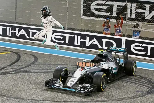  ?? — AP ?? Joy of a champion: Nico Rosberg celebrates after winning the 2016 Formula One world title at the Abu Dhabi Grand Prix in the United Arab Emirates yesterday.