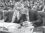  ?? RYAN REMIORZ/The Canadian Press ?? Foreign Affairs Minister John Baird, right, with chief of staff Garry Kellar, plans to condemn Iran’s human rights record at a UN meeting in November, as Canada has done since 2002.