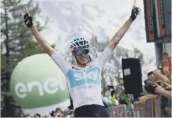  ??  ?? Chris Froome celebrates after powering to victory on stage 19.