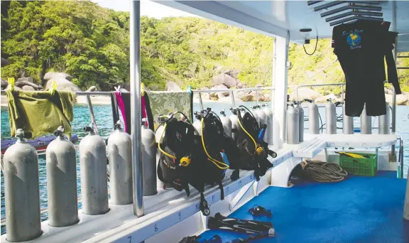  ?? PHOTOS: ERIN E. WILLIAMS/THE WASHINGTON POST ?? Diving equipment is lined up and ready to use on a boat sitting off the Similan Islands in Thailand’s Andaman Sea.