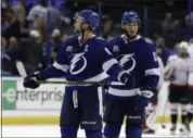  ?? CHRIS O’MEARA — THE ASSOCIATED PRESS ?? Lightning center Steven Stamkos (91) and center J.T. Miller leave the ice after losing to the Capitals during Game 1 of the Eastern Conference final May 12 .