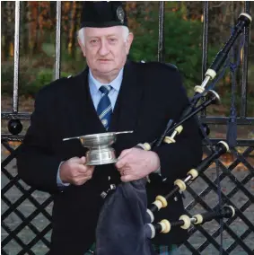  ??  ?? Cullen Piper Con Houlihan winner in the All Ireland Solo contest held in Belfast pictured with the MacPhee Memorial Trophy.