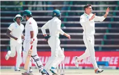  ?? AFP ?? South Africa’s Duanne Olivier celebrates after dismissing Sarfraz Ahmad during the fourth day of the third Test.