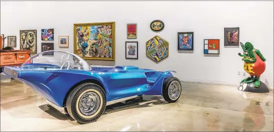  ?? Photograph­s by Kahn Media ?? “AUTO-DIDACTIC: The Juxtapoz School” is an exhibition of art cars and art about cars at the Petersen Automotive Museum, showcasing the efforts of 50 artists.