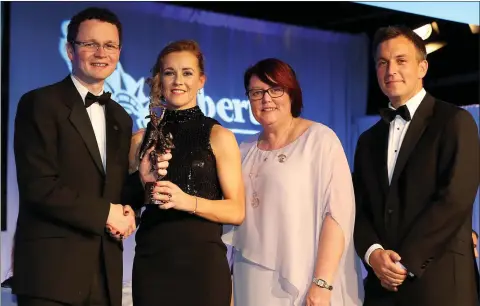  ??  ?? Kate Kelly receives her ninth All Star from Minister for Sport and Tourism Patrick O’Donovan T.D., with Camogie President Catherine Neary and Alan Johnston of Liberty Insurance looking on.