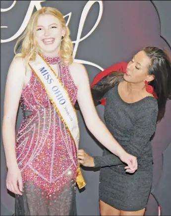  ?? Staff photo/ Alex Guerrero ?? Genoa Arling beams with pride as the Miss Ohio spokespers­on sash is placed across her. A Minster native and Bluffton University student, Arling is an advocate for suicide awareness and champion of mental health wellness.