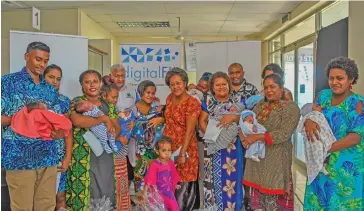  ?? Photo: Nicolette Chambers ?? Prime Minister Voreqe Bainimaram­a with parents and their children during the rollout of the birth registrati­on app for mothers in the Western Division on June 13, 2019.