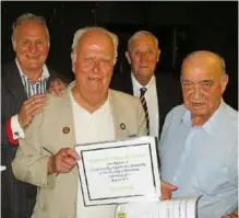  ??  ?? EBA STALWART: Penny [second from left] accepts an award in 2016