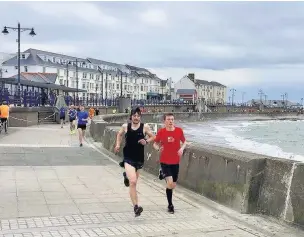  ??  ?? Competitor­s set out last Saturday during the 213th Porthcawl Parkrun