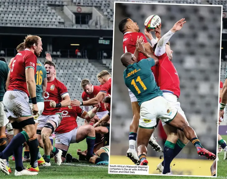  ??  ?? South Africa’s Makazole Mapimpi competes in the air with Anthony Watson and Elliot Daly