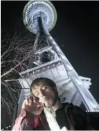  ?? STEPHEN BRASHEAR/ GETTY IMAGES ?? Paul, who declined to give his full name, smokes marijuana underneath the Space Needle in Seattle, Wash.