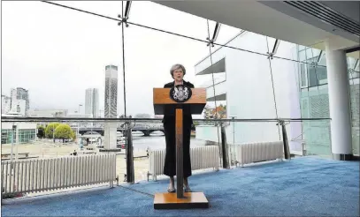  ?? Charles Mcquillan ?? British Prime Minister Theresa May gives a speech Friday at the Waterfront Hall, in Belfast, Northern Ireland. The Associated Press