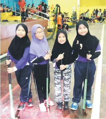  ??  ?? A group of happy primary school girls during a hockey clinic.