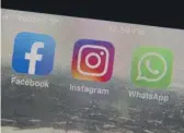  ?? AP FILE ?? The mobile phone apps for Facebook, Instagram and WhatsApp. Facebook’s ad system is so customizab­le that advertiser­s can target a single user out of billions on the platform, if they wanted.