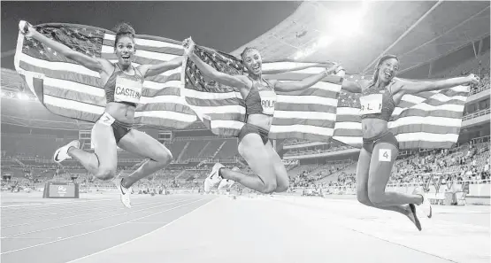 ?? Cameron Spencer / Getty Images ?? The 100-meter hurdles produced an American sweep by, from left, bronze medalist Kristi Castlin, gold medalist Brianna Rollins and silver medalist Nia Ali.
